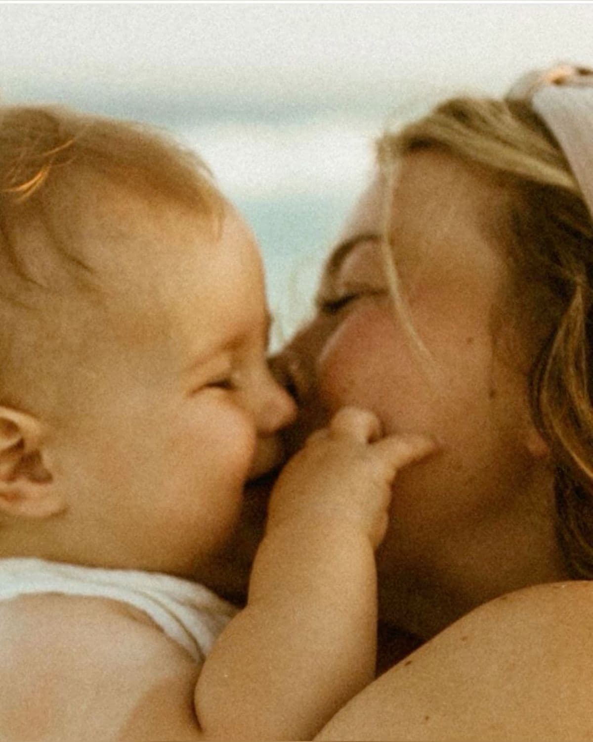 Parent holding happy baby